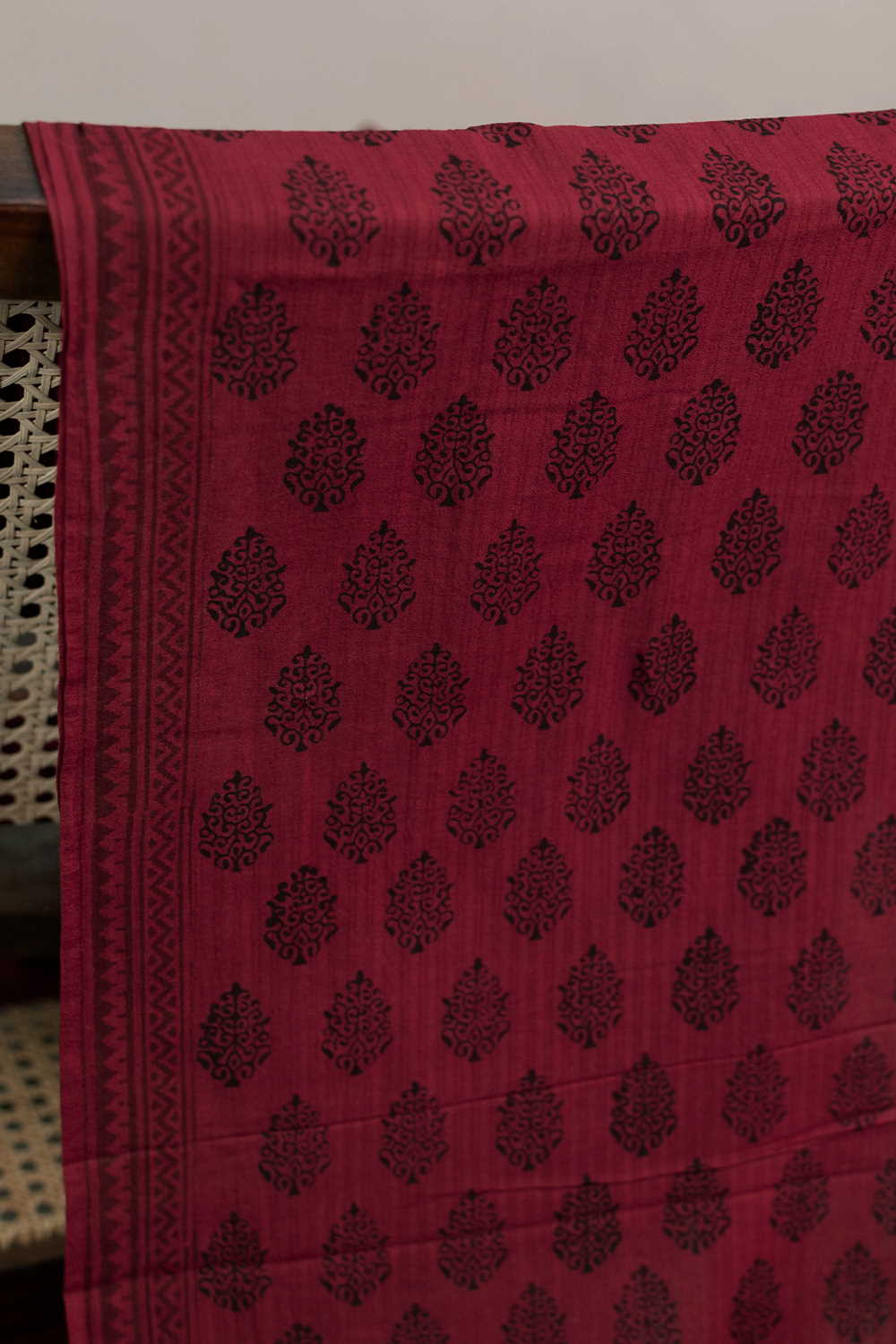 Black Motifs on Maroon Bagh Cotton Fabric-1 M