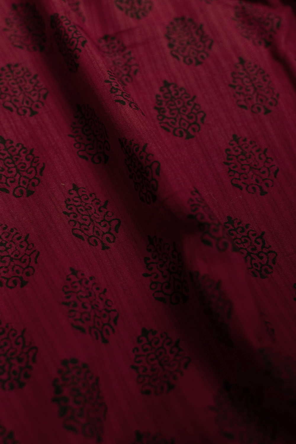Black Motifs on Maroon Bagh Cotton Fabric-1 M