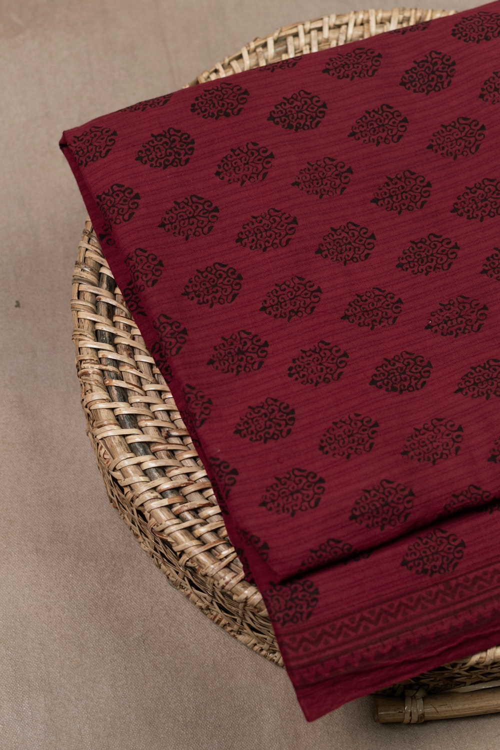 Black Motifs on Maroon Bagh Cotton Fabric-1 M