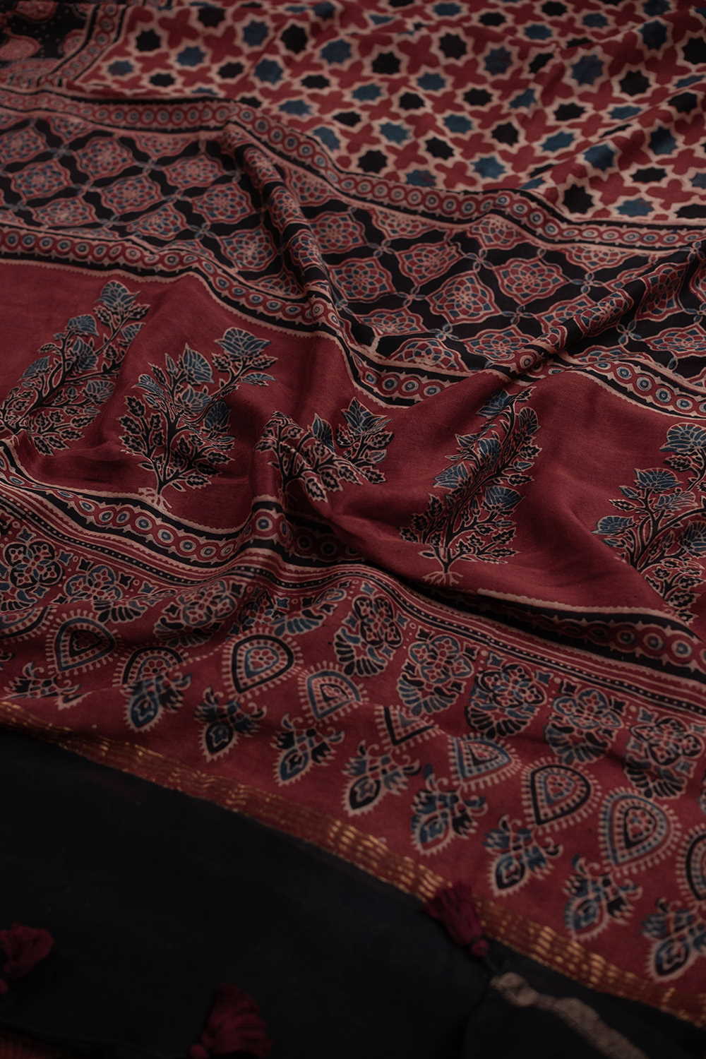 Motifs on Maroon Ajrak Chanderi saree