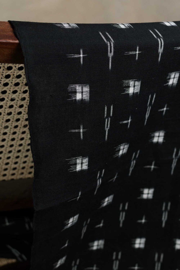Cream Patterns on Black Ikat Cotton Fabric
