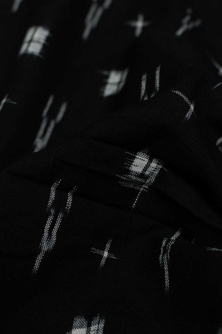 Cream Patterns on Black Ikat Cotton Fabric