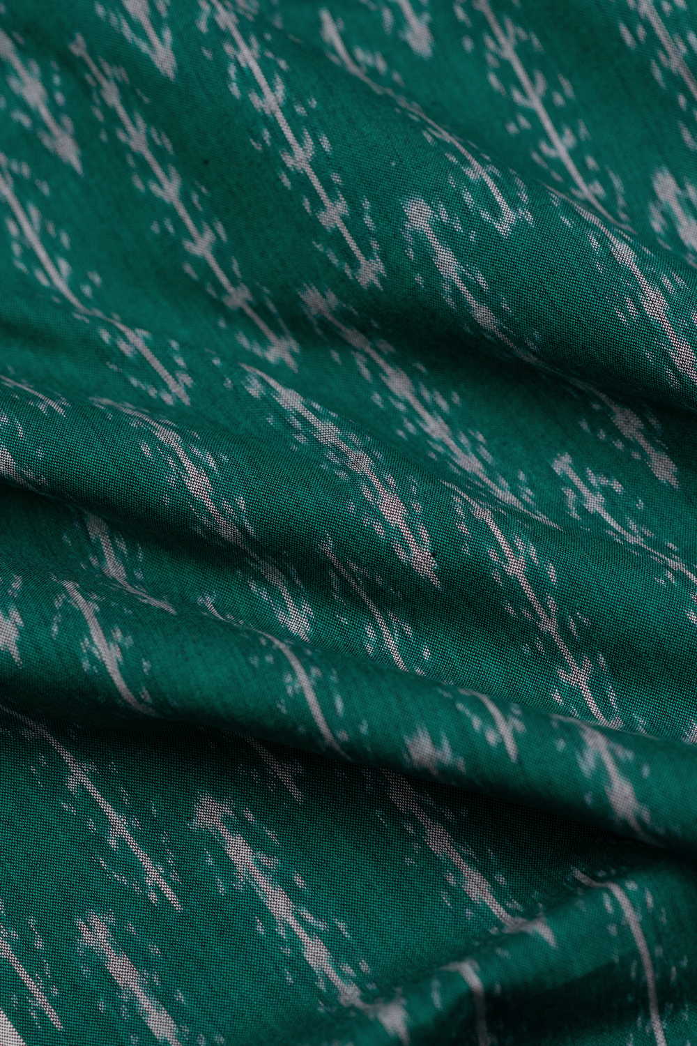 Pattern on Green Ikat Cotton Fabric