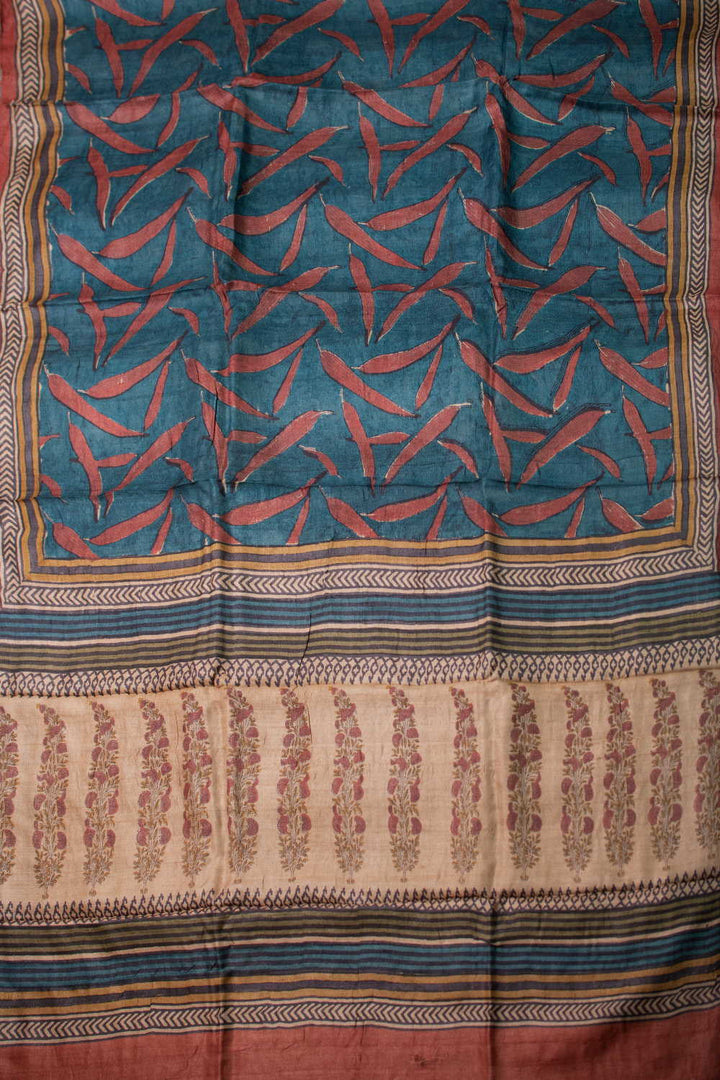 Patterns on Faded Blue Block Printed Tussar saree