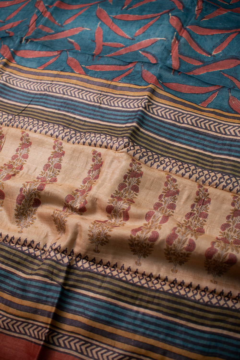 Patterns on Faded Blue Block Printed Tussar saree