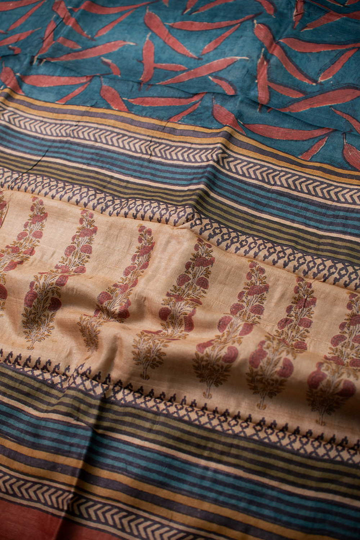 Patterns on Faded Blue Block Printed Tussar saree