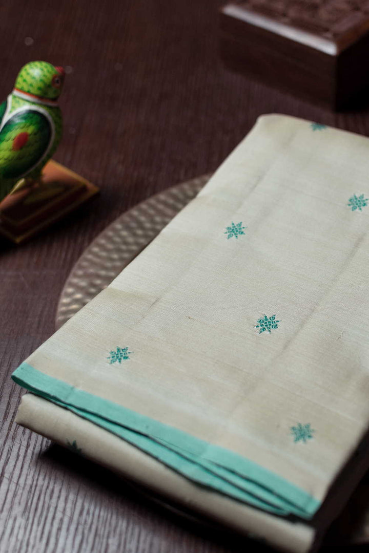 Green Thread Butta on Cream Kanchipuram Silk saree