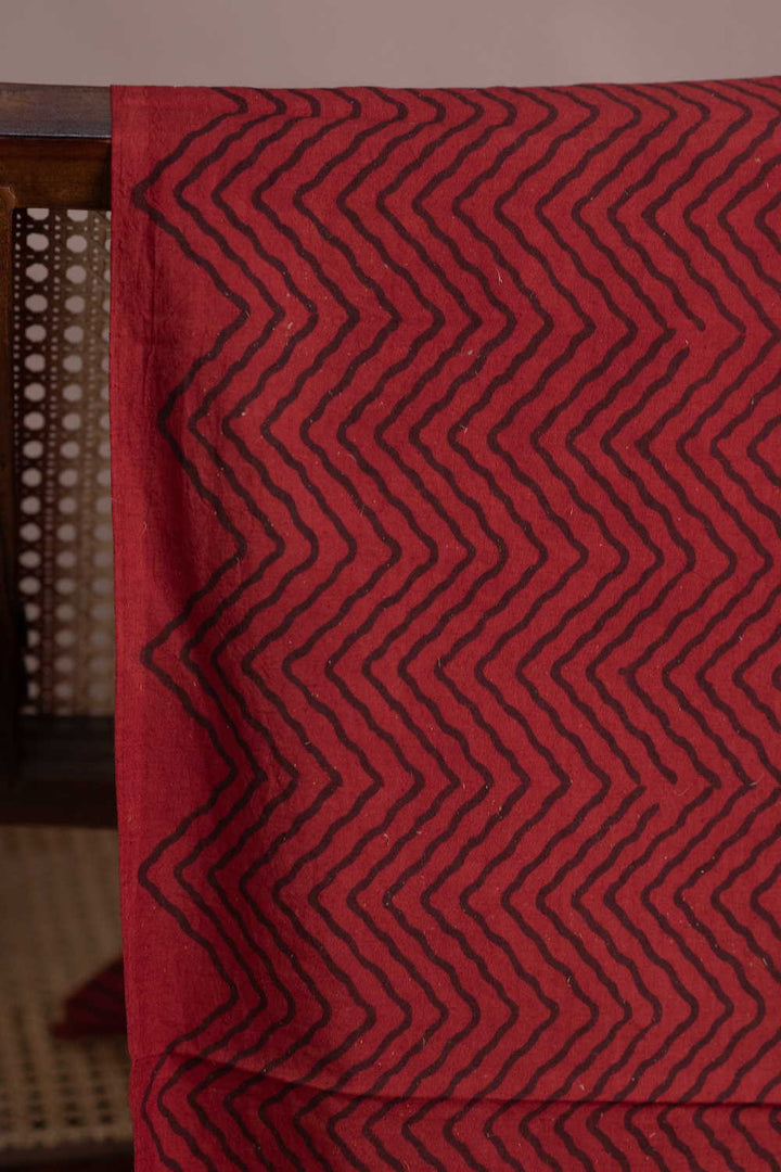 Chevron Pattern on Maroon Ajrak Cotton Fabric