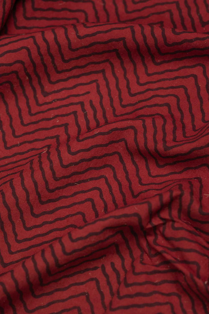 Chevron Pattern on Maroon Ajrak Cotton Fabric