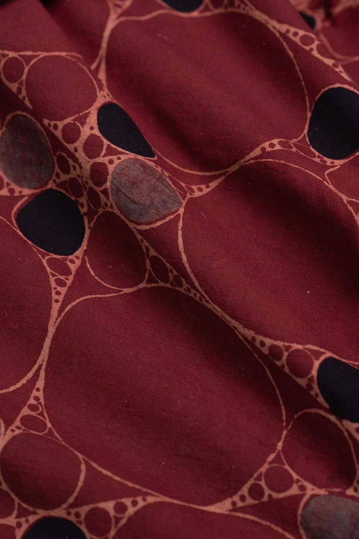 Irregular Circles on Maroon Ajrak Cotton Fabric