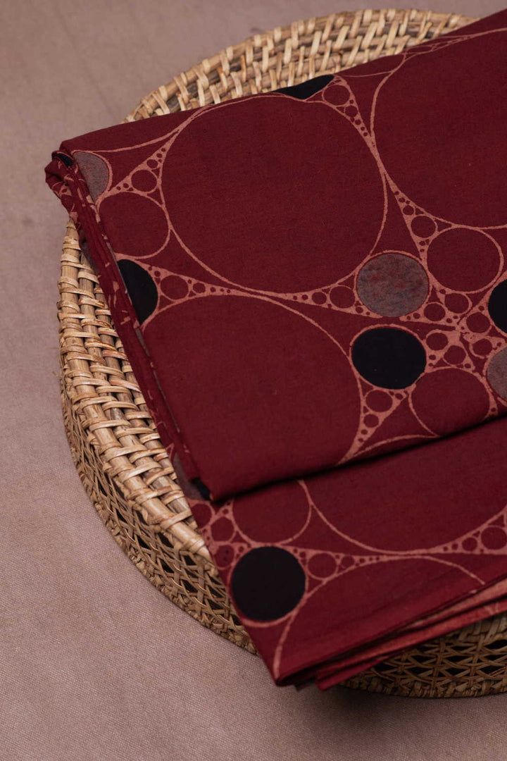 Irregular Circles on Maroon Ajrak Cotton Fabric